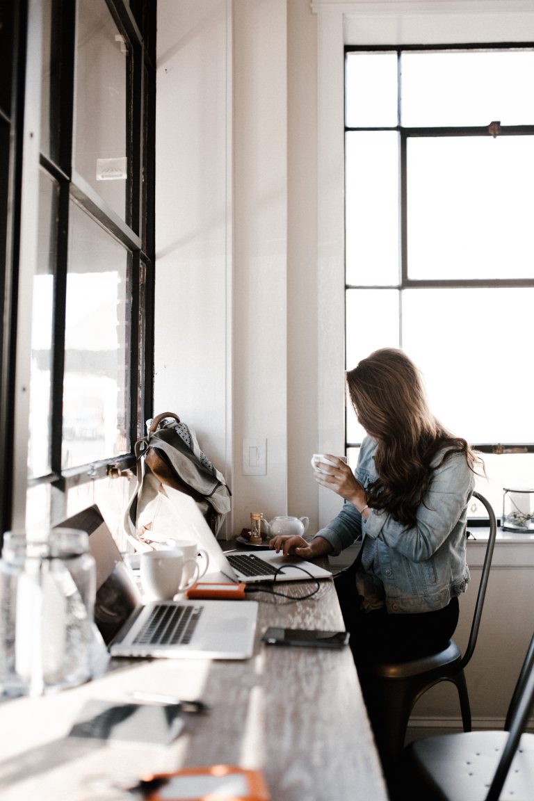 Woman at coffee shop on computer