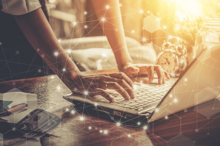 businesswoman working on laptop creating crisis marketing during Covid-19